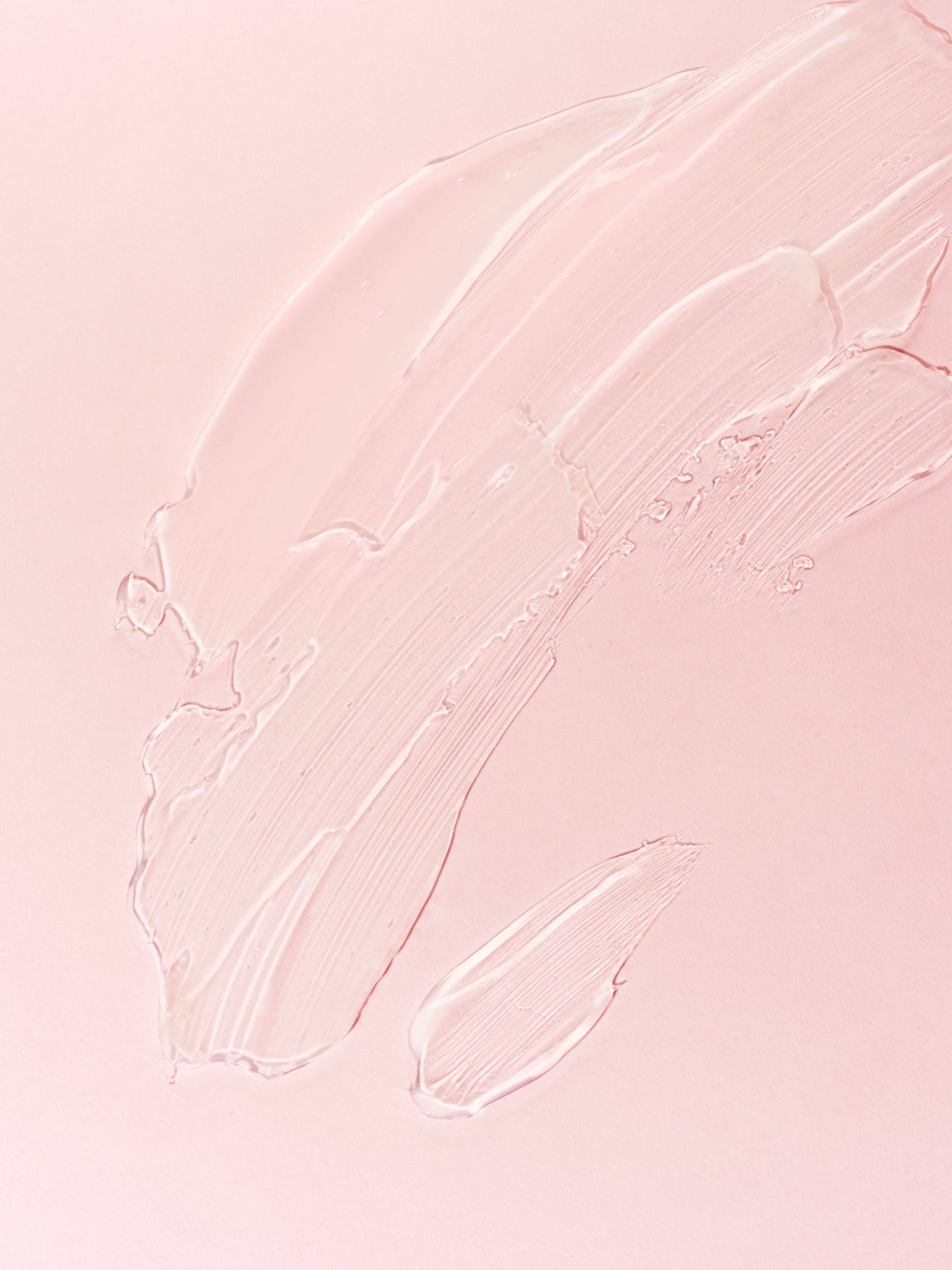 Close-up of pink textured skin1004 madagascar centel apremizing light gel cream on a light pink background