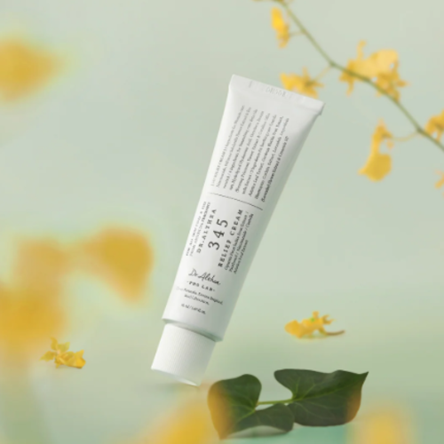 Tube of skincare product with a floral background