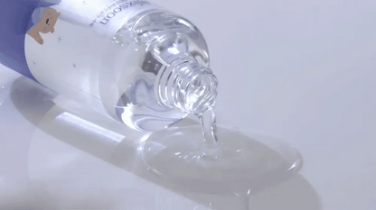 Close-up of a clear bottle Mixsoon Glacier Water Hyaluronic Acid Serum with a purple cap on a white background